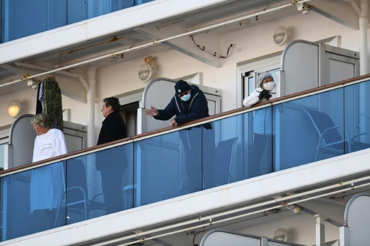 Passengers on balconies of the Diamond Princess cruise ship