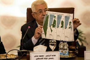 Palestinian president Mahmud Abbas shows maps of historical Palestine during a February 2020 Arab League meeting on President Donald Trump's proposed Middle East plan