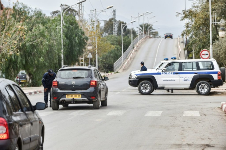 Police cars block access to a road near a courthouse in the Algerian city of Blida where the appeal hearing was held