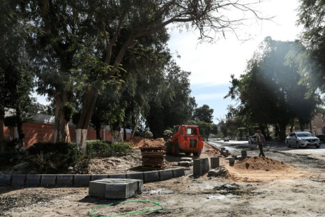 Construction crews are building new highways through Heliopolis and uprooting its century-old trees