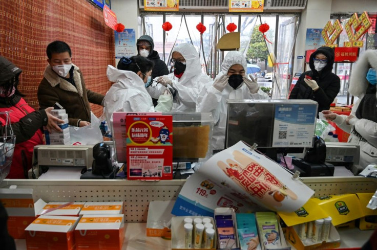 About Wuhan, the usual New Year visits are limited to a worried dash to the pharmacy, where customers are greeted by staff wearing full-body protective suits and double masks