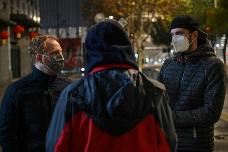 French residents in Wuhan, Remy (L) and Jonathan (R) speak during a interview with AFP about the possibility of being evacuated from Wuhan