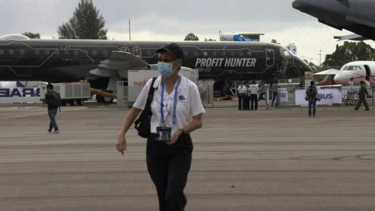 Asia's biggest air show opened in Singapore on Tuesday under the shadow of a deadly coronavirus outbreak that has forced dozens of companies to withdraw and is threatening to hammer the aviation industry.