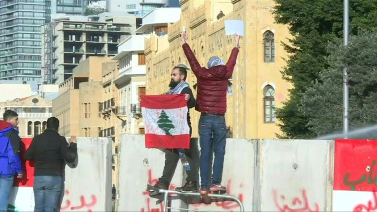 IMAGESLebanese demonstrators defy water cannon and tear gas as they protest ahead of a confidence vote by lawmakers over a new government. The country has been rocked by protests since October 17.