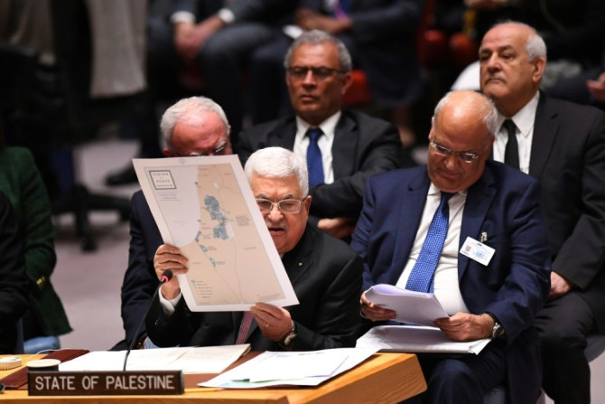 Palestinian president Mahmud Abbas holds up a map as he urges the UN Security Council to reject US President Donald Trump's Middle East plan