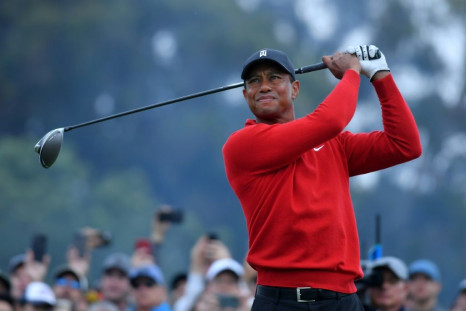 Tiger Woods, seen here teeing off on the 18th hole at Torrey Pines, says finding a solution to golf's ever-increasing hitting distance is "a delicate balancing act"