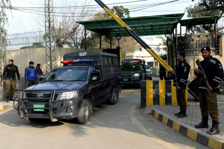 A convoy carrying Hafiz Saeed leaves court after the verdict in Lahore