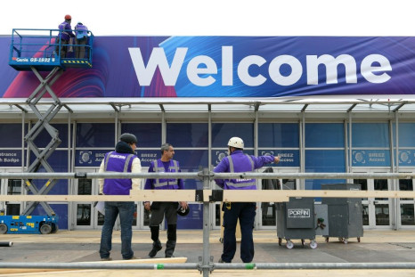 As organisers were considering whether to cancel this year's Mobile World Congress, workers were hanging up the 'welcome' sign at the Barcelona venue