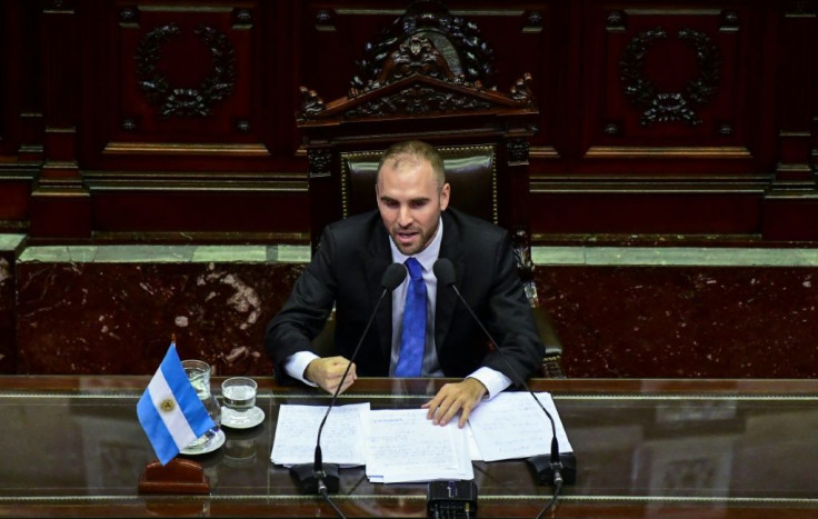 Argentina's Economy Minister Martin Guzman is pictured addressing Congress where he lamented that "the country faces a debt burden preventing it from avoiding a recession spiral"