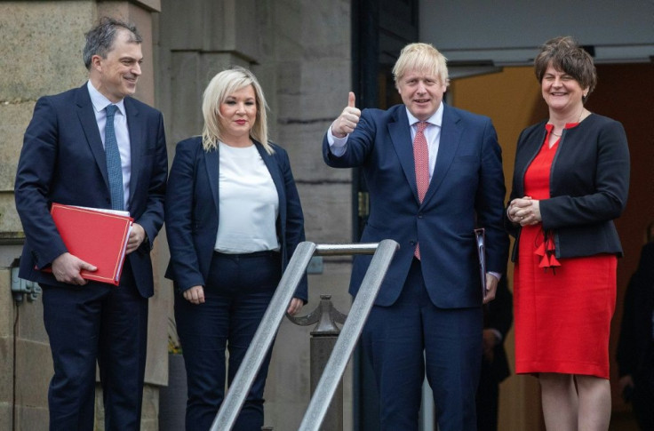 Julian Smith (L), pictured here with Johnson and Northern Ireland's First Minister Arlene Foster (R) in January, was credited with helping restore the power-sharing government to Belfast