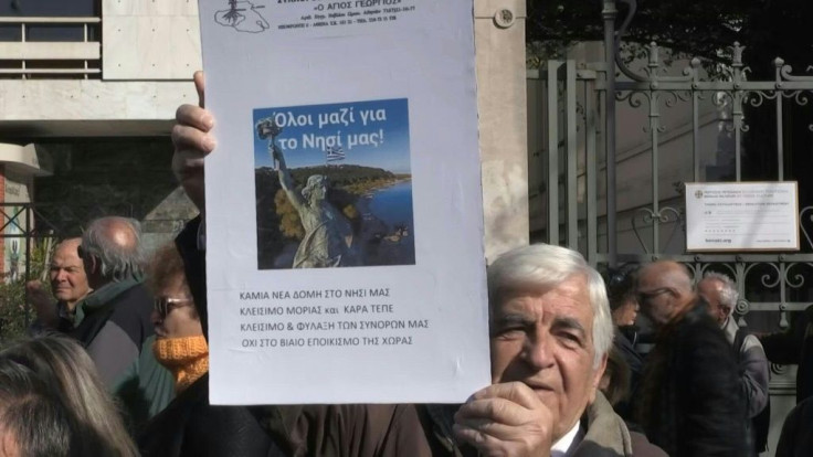 Greek officials and residents from islands harbouring thousands of asylum-seekers stage a protest in Athens against plans to build new camps, gathering outside the interior ministry, and brandishing banners against the camps project.
