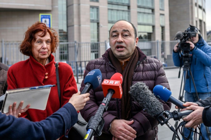 Mine Aydostlu, mother of Turkish novelist Asli Erdogan and Erdogan's lawyer Erdal Dogan speak to the media after the court ruling