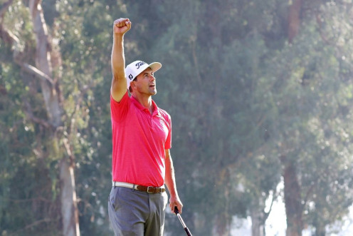 Australia's Adam Scott celebrates his two-shot victory at the Genesis Invitational, capped by a par at the 18th hole at Riviera Country Club