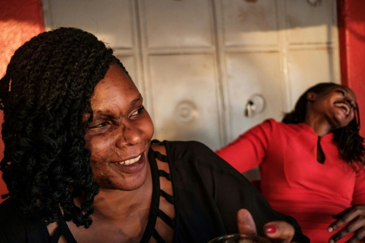 Close friends Reenah Ntoreinwe, pictured left, and Linette Kirungi, right, met each other as acid attack survivors