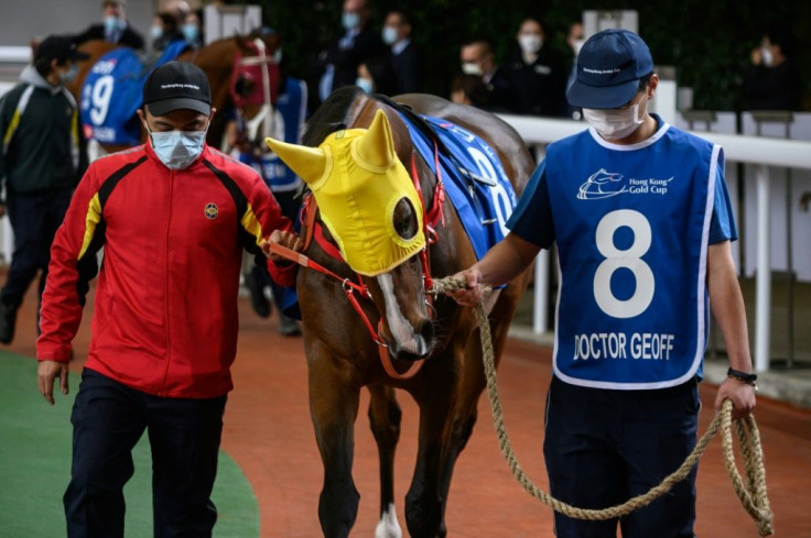 It was a surreal meeting at Sha Tin in front of just 307 spectators, made up entirely of owners and guests, with only the horses not wearing masks