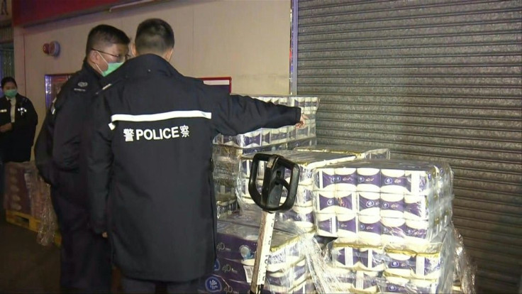 Hong Kong police are on the scene outside a supermarket after armed robbers steal hundreds of toilet rolls in a city wracked by shortages caused by coronavirus panic-buying.