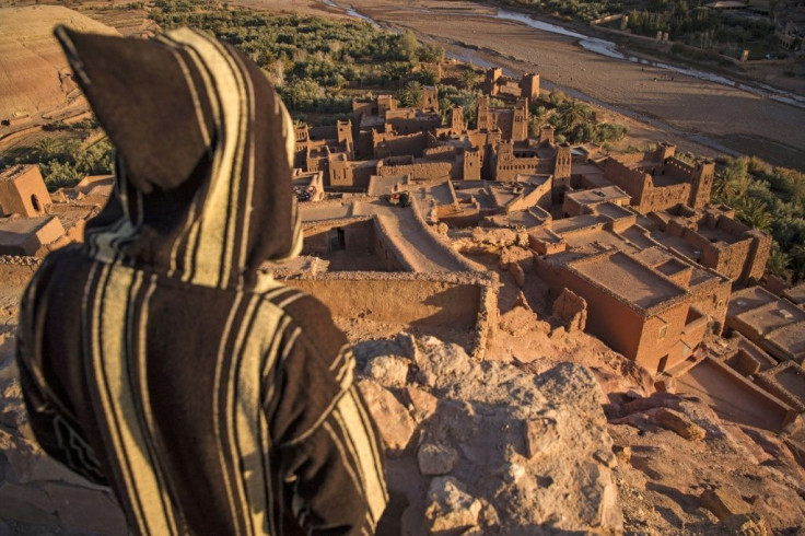 A man overlooks the fortified old city of Ait-Ben-Haddou