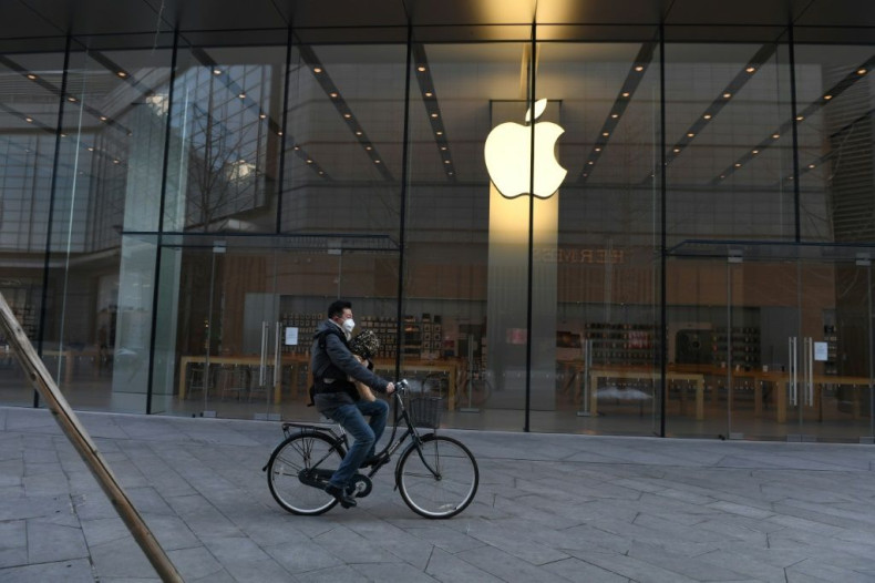 A man cycles past a closed Apple store in Beijing on February 8