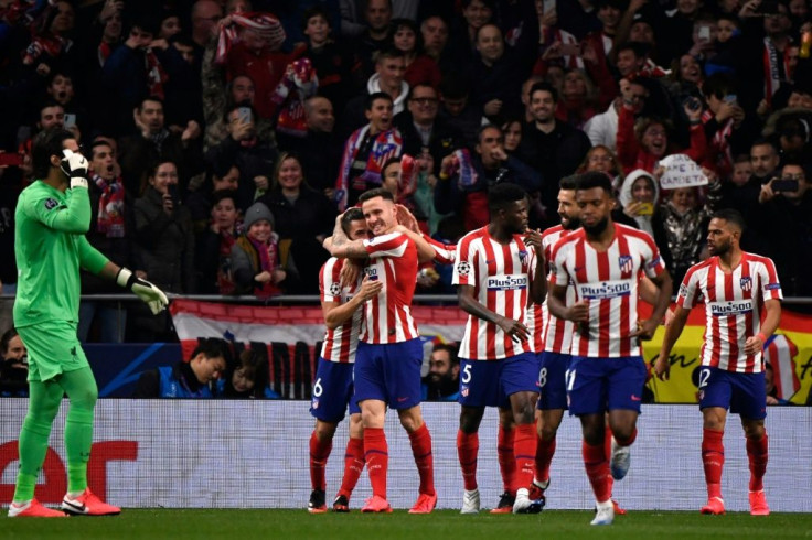 Atletico Madrid's Saul Niguez (C) celebrates scoring an early goal against Liverpool at the Wanda Metropolitano on Tuesday.