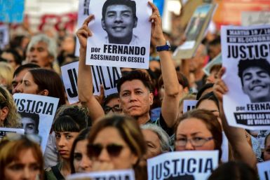 People demonstrate outside the Congress building in Buenos Aires to demand justice for the killers of 18-year-old Fernando Baez