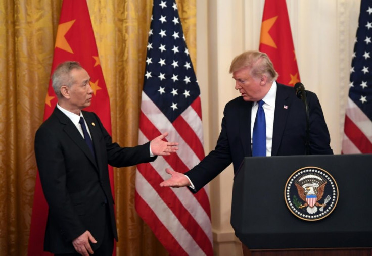 US President Donald Trump at a press conference with Chinaâs Vice Premier Liu He (L), the countryâs top trade negotiator, in the East Room of the White House