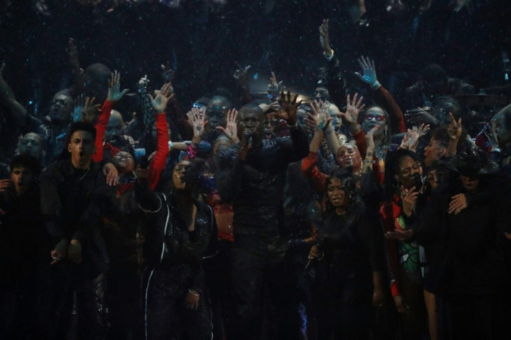 Leading grime artist Stormzy delivered an explosive set which involved rain, firecrackers and more than fifty people on stage