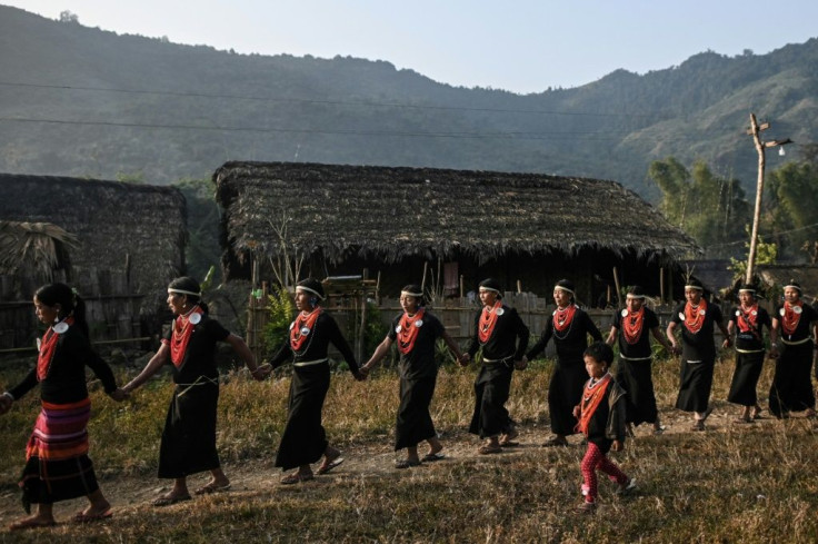 The women continue their campfire ritual through until dawn in a test of physical endurance helped by an occasional draught of rice wine