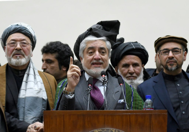 Afghan presidential election opposition candidate Abdullah Abdullah (C) has said he will form a government in parallel to that of incumbent Ashraf Ghani, who was declared the winner