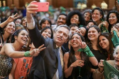 Then president-elect Alberto Fernandez poses for a selfie with women abortion campaigners in Buenos Aires in November 2019