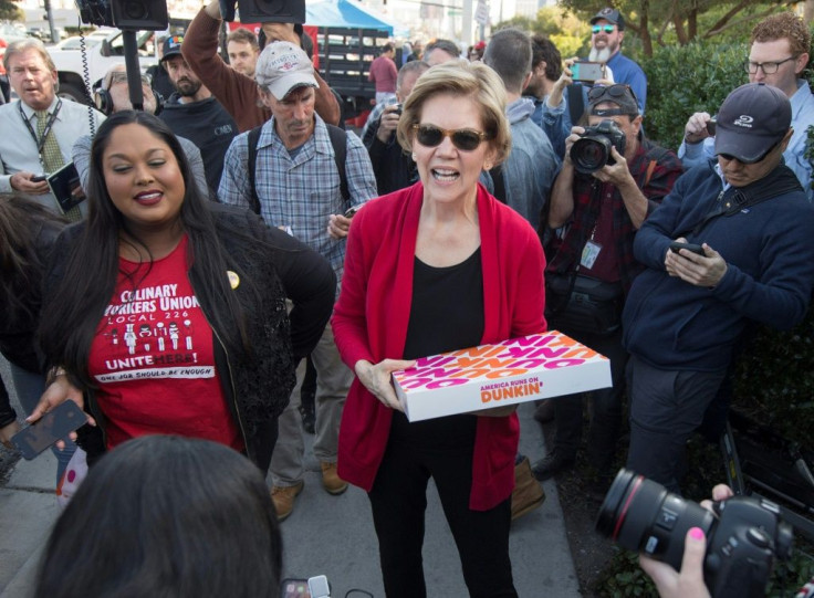 Democratic presidential hopeful Elizabeth Warren, shown here passing out treats to protesting workers in Las Vegas, was under pressure to deliver a command performance in the Democratic debate on February 19, 2020