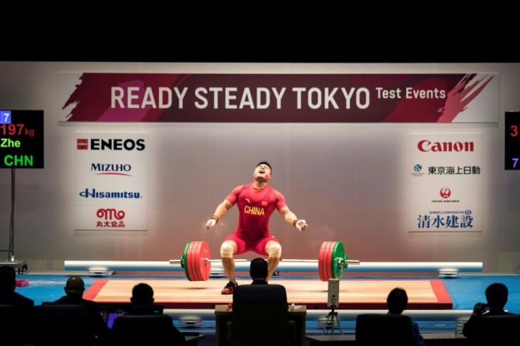 China's Yang Zhe in action during a weightlifting test event for Tokyo 2020