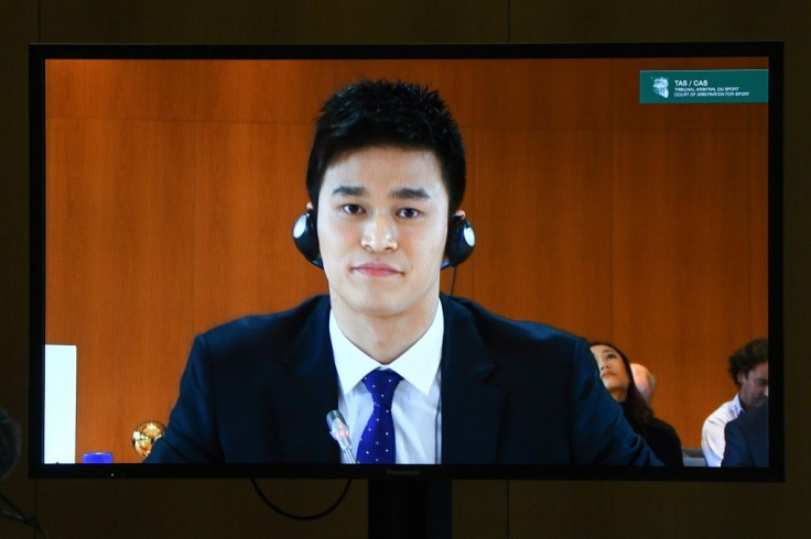 China's swimming star Sun Yang seen on a television screen during a public hearing before the Court of Arbitration for Sport