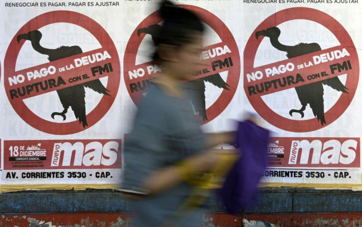 "No debt payments - break with the IMF" reads a poster in Buenos Aires on February 19, portraying the International Monetary Fund as a vulture