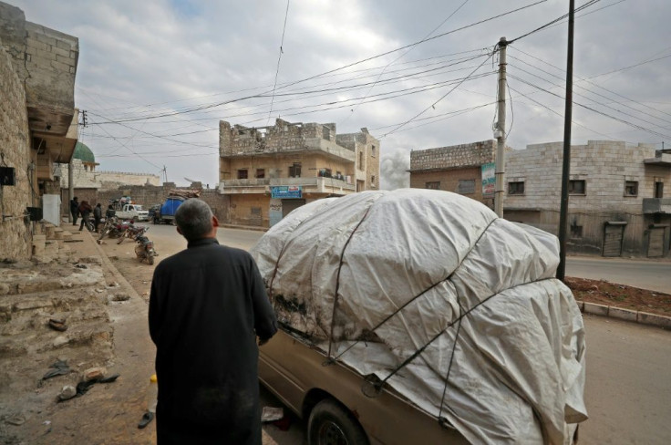 Spotting a plume of smoke from an apparent air strike not far away, Abu Mohammed knows it is time to leave