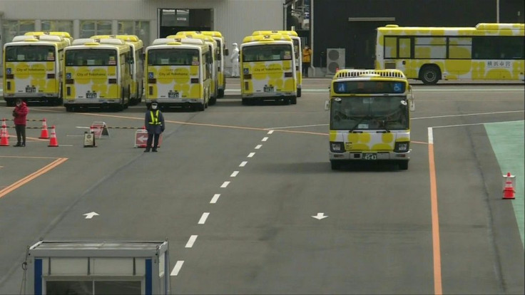 IMAGESBuses start transporting passengers who have tested negative for the new coronavirus as they begin leaving a cruise ship in Japan that has seen more than 500 cases of the potentially deadly disease.