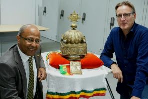 Dutch-Ethiopian Sirak Asfaw, left, and art detective Arthur Brand pose with the crown at a high-security facility in the Netherlands in September last year