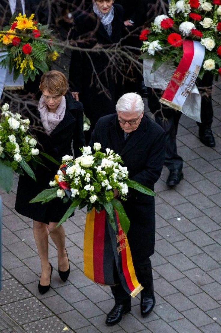 German President Frank-Walter Steinmeier and his wife Elke Buedenbender lay wreaths close to the crime scene in Hanau