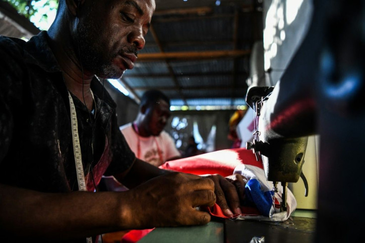 Tailors work on Carnival costumes in Port-au-Prince