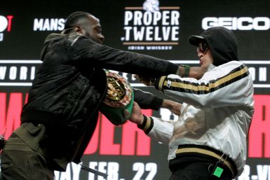 World Boxing Council heavyweight champion Deontay Wilder (left) and Tyson Fury (right) come to blows at this week's press conference