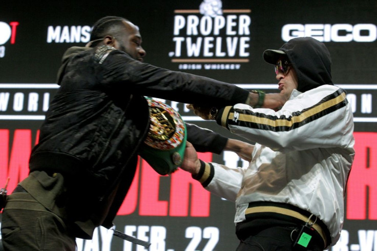 World Boxing Council heavyweight champion Deontay Wilder (left) and Tyson Fury (right) come to blows at this week's press conference