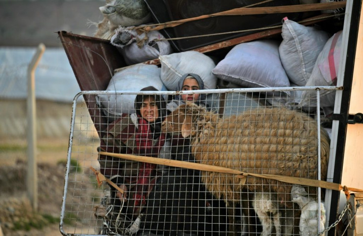 Merkel and Macron also voiced concern about a 'humanitarian catastrophe' that has seen an estimated 900,000 people flee their homes since December