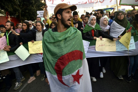 Algerian students and other protesters take part in an anti-government demonstration in the capital Algiers, on February 18