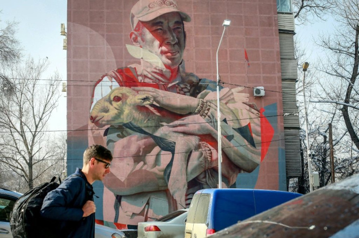 A mural in Almaty depicts Yerlan Nurgaliyev cradling a baby saiga antelope