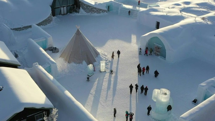 Nearly 200 kilometres above the Arctic Circle in northern Sweden, dozens of tourists come to visit an ice hotel, posing for photos next to frozen pillars and beds made from ice from a nearby river.