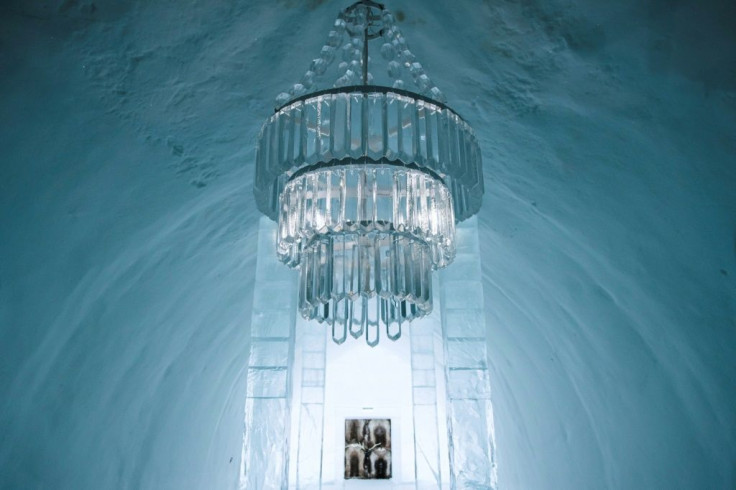 An ice chandelier hanging in the main hall of the ice hotel