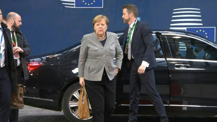 IMAGESGerman Chancellor Angela Merkel, French President Emmanuel Macron and EU Council chief Charles Michel arrive for the second day of a special summit on the bloc's longterm budget.