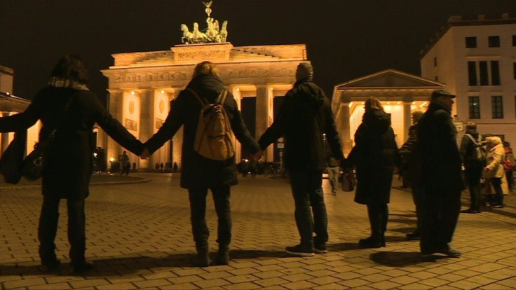 Berliners form human chain at the Brandenburg Gate after the Hanau killings shooting