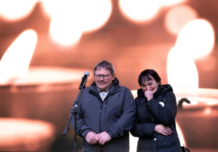 Kuciak's parents Jozef and Jana Kuciak address the memorial crowd on Friday