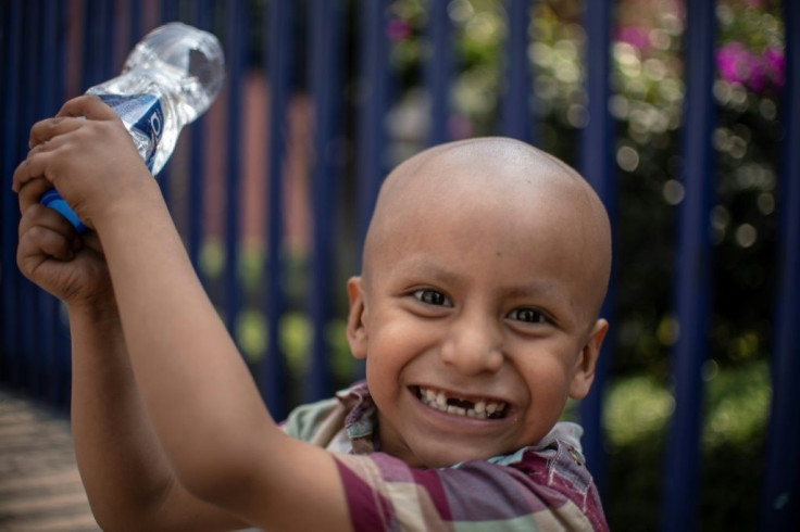 Mexican four-year-old Hermes Soto, diagnosed with cancer, smiles outside the Children's Hospital in Mexico City