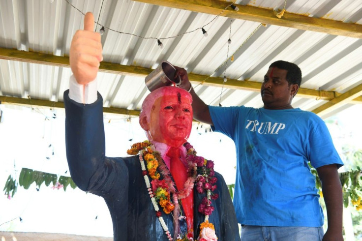Farmer Bussa Krishna performs a ritual on a statue of Donald Trump ahead of the US president's trip to India